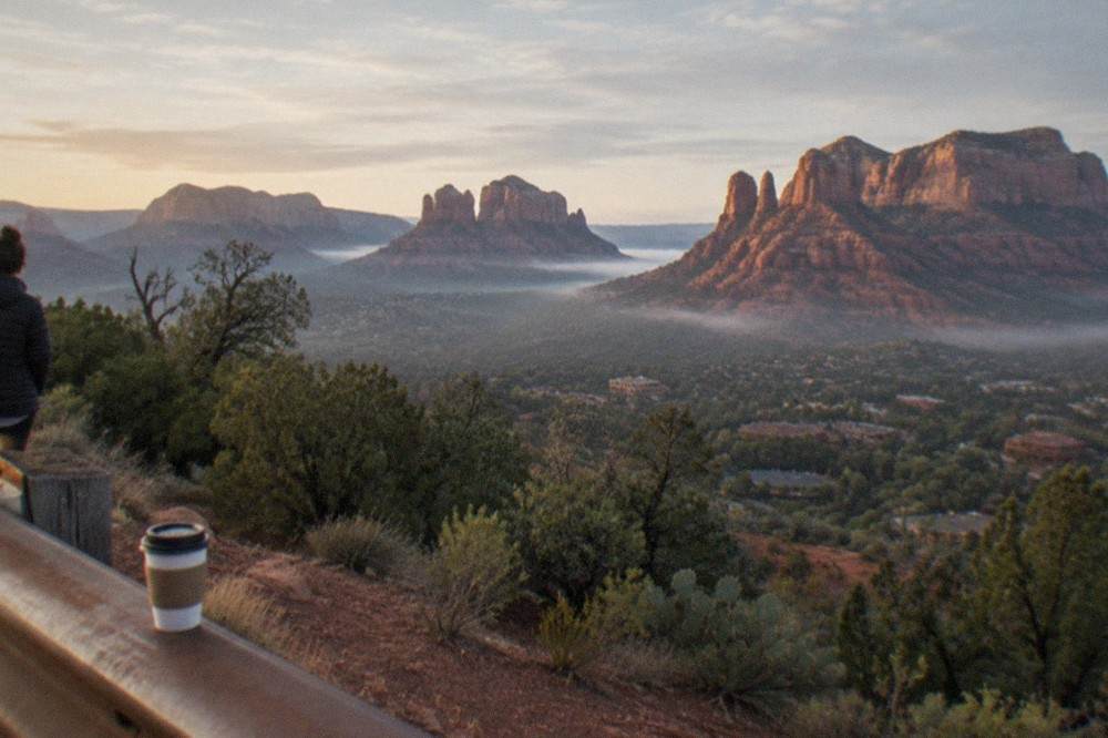 Red rock buttes rising above Sedona under a clear morning sky