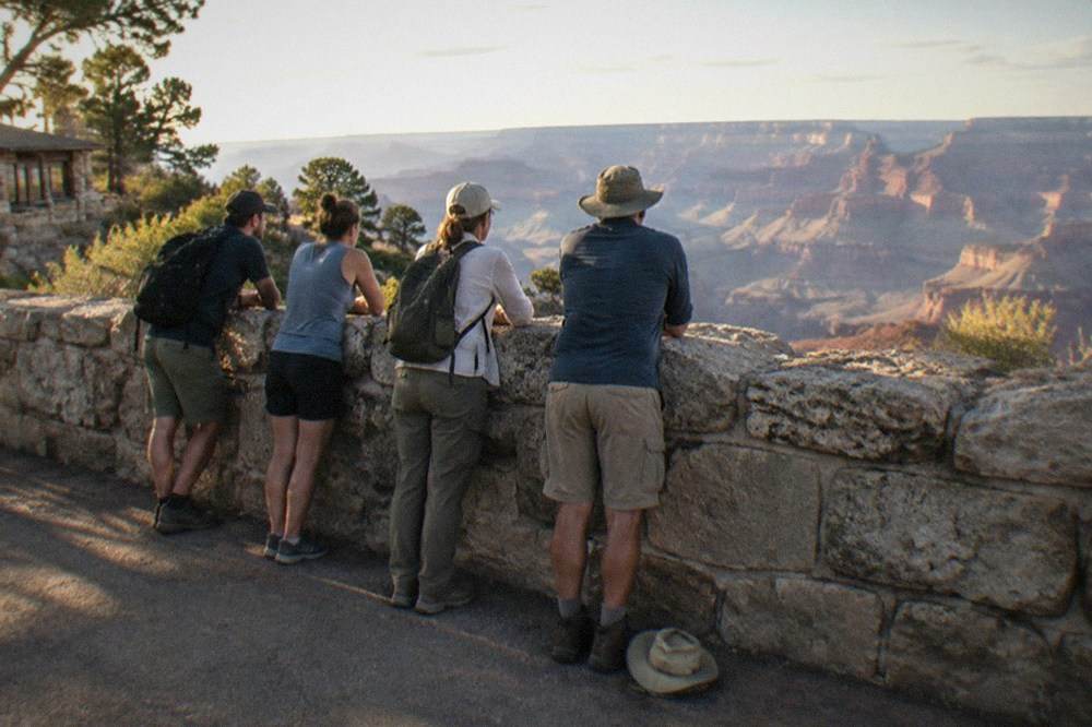 Small group of travelers at a Grand Canyon South Rim viewpoint
