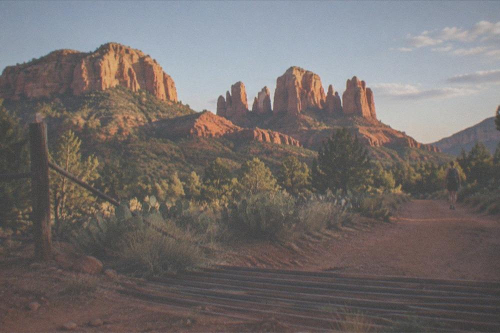 Red rock formations of Sedona under afternoon light along the route to the Grand Canyon