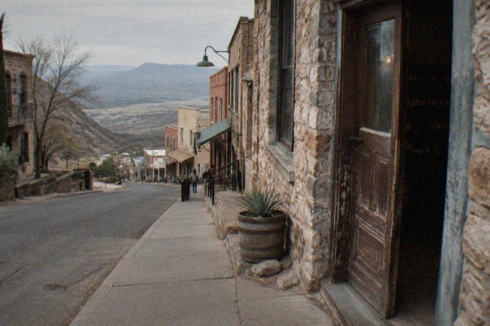Historic buildings on a steep street in Jerome, Arizona with valley views