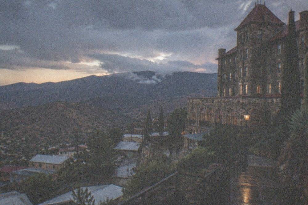Stone facade of the Jerome Grand Hotel on the hillside above town