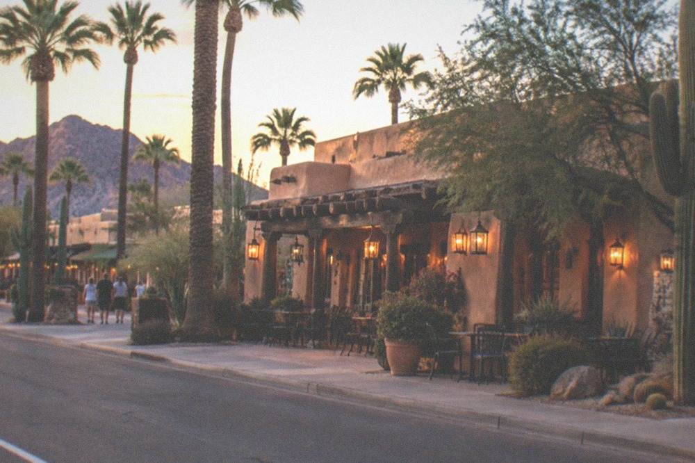 Scottsdale Old Town street with shops, palm trees and evening light
